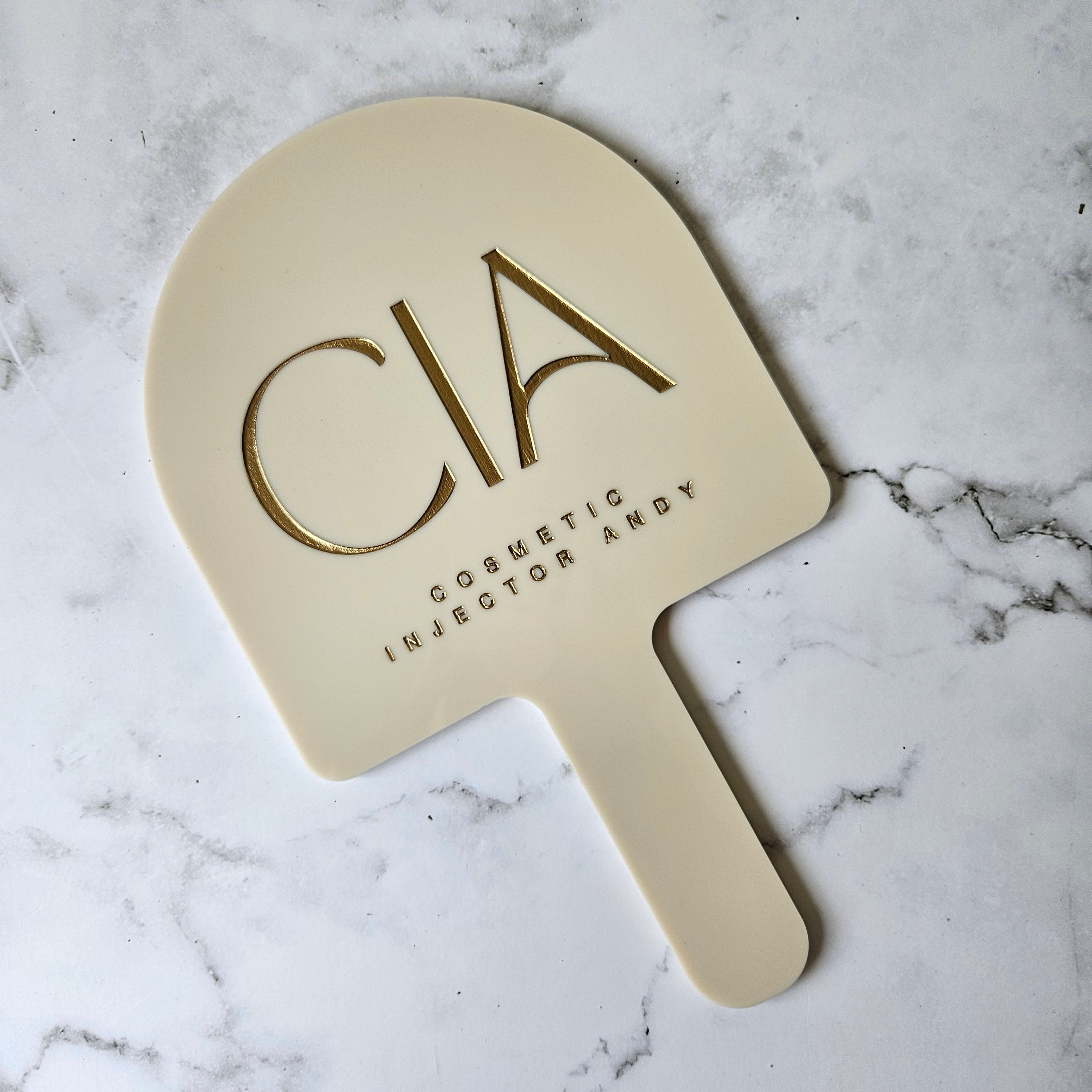 Custom Handheld Mirror with Logo for Injectable Clinic - Arch handheld mirror in beige acrylic with Gold logo