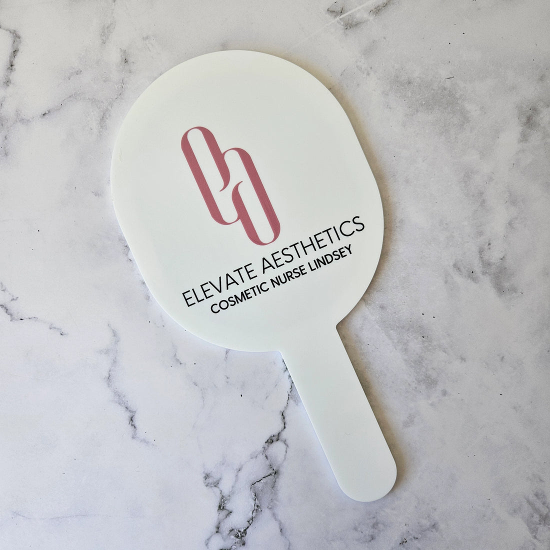 Oval Handheld Mirror in White Acrylic and Black Logo