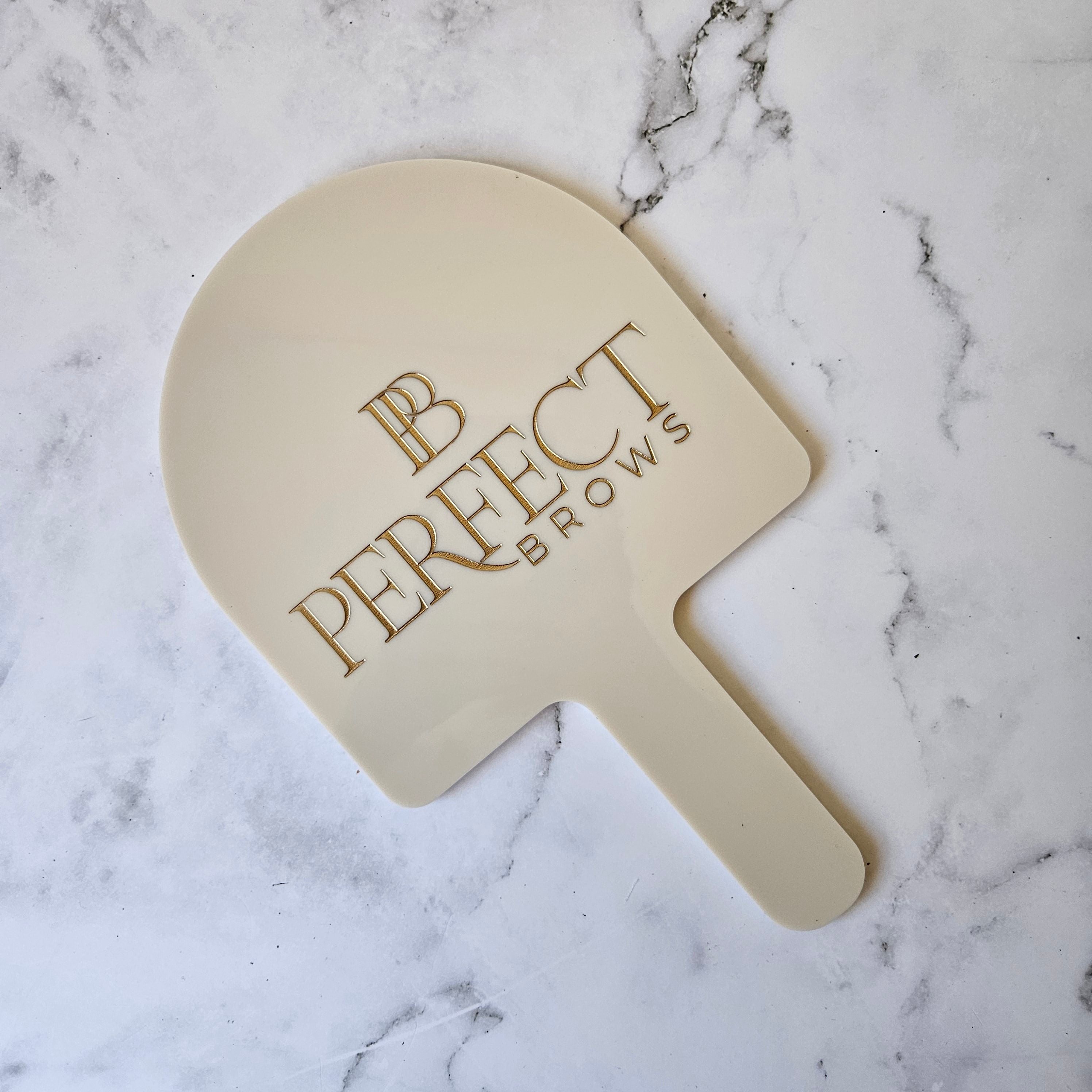 Custom Handheld Mirror Personalised with Branding in Gold for Salons made by Custom Aesthetic Designs