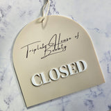 Closed sign in arch shape with 3D letters