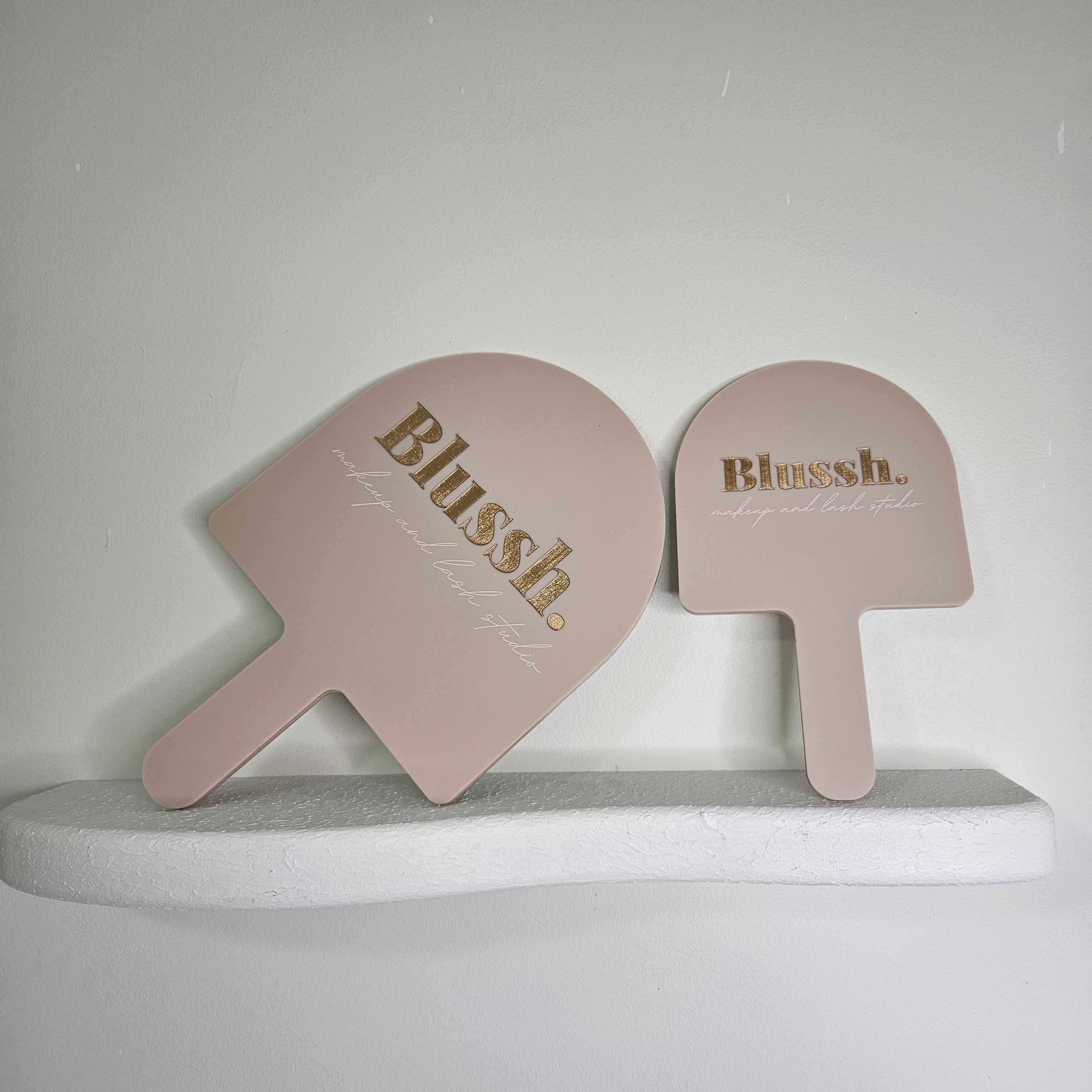 arch hand held mirrors in XL & medium size, branded with logo