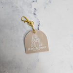 Arch qr code keychain with white logo and gold keyring