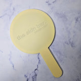 Round Handheld Mirror in Pastel Yellow with engraved logo, no colour