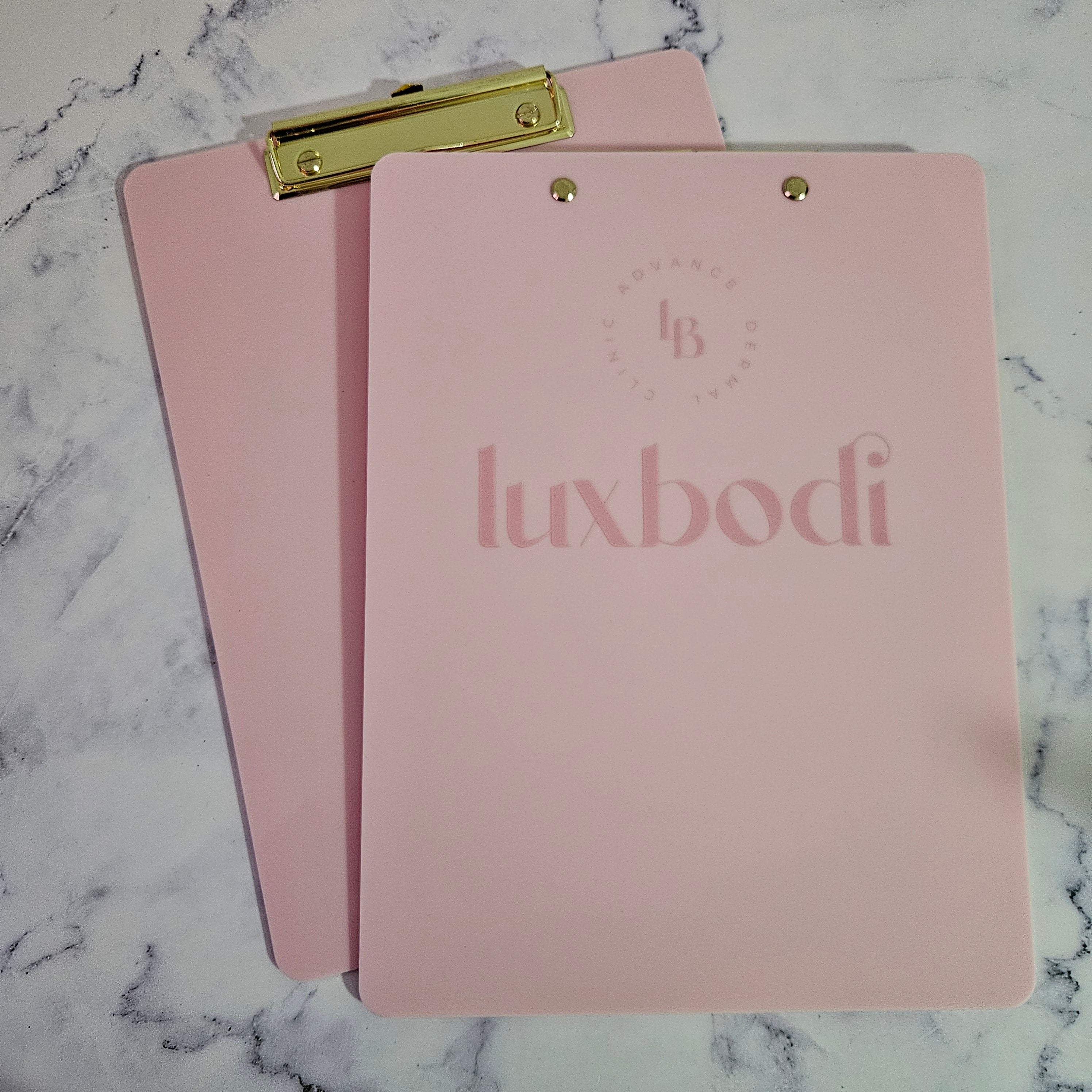 Branded clipboard in pink and gold