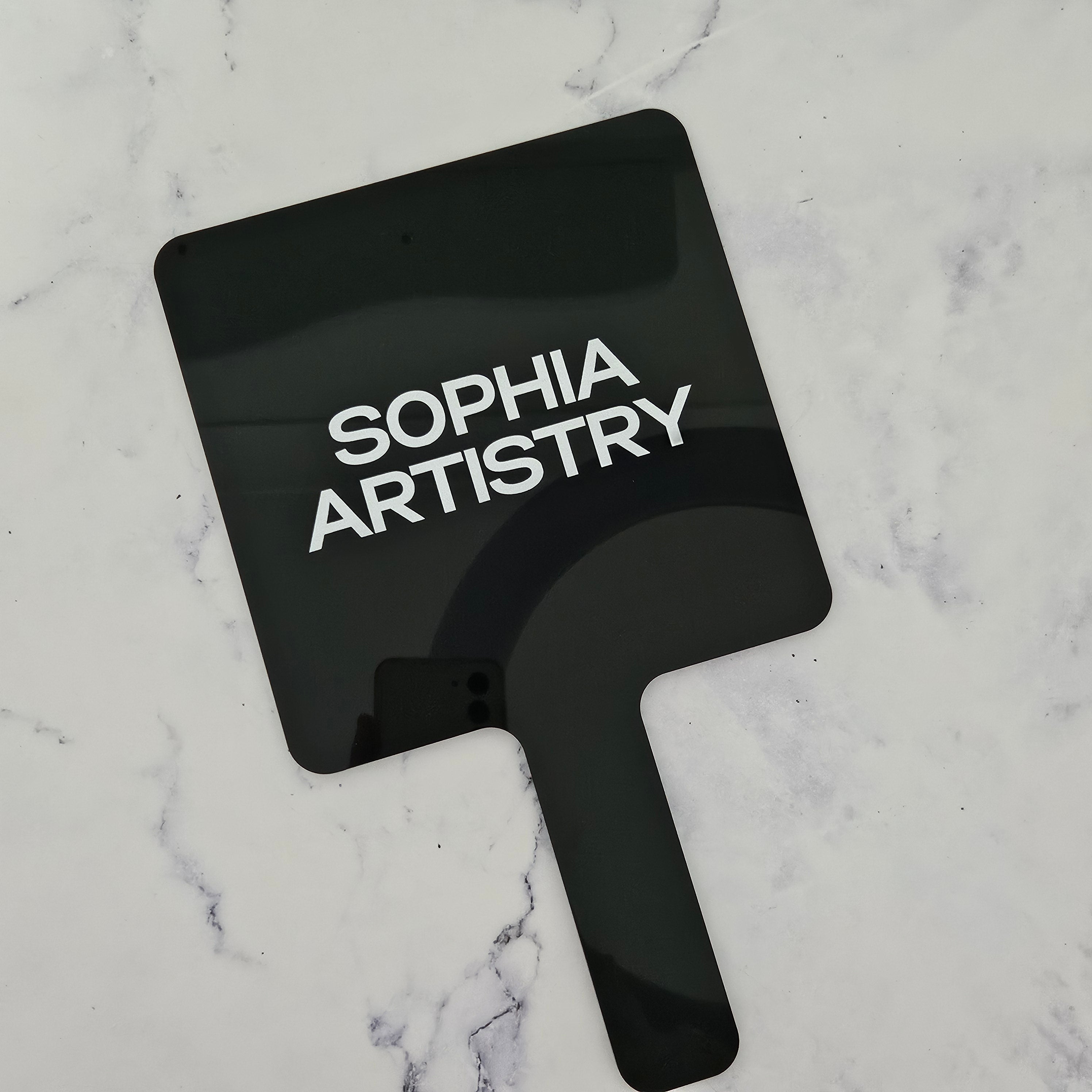 Custom handheld mirror in Black acrylic (gloss) & White logo