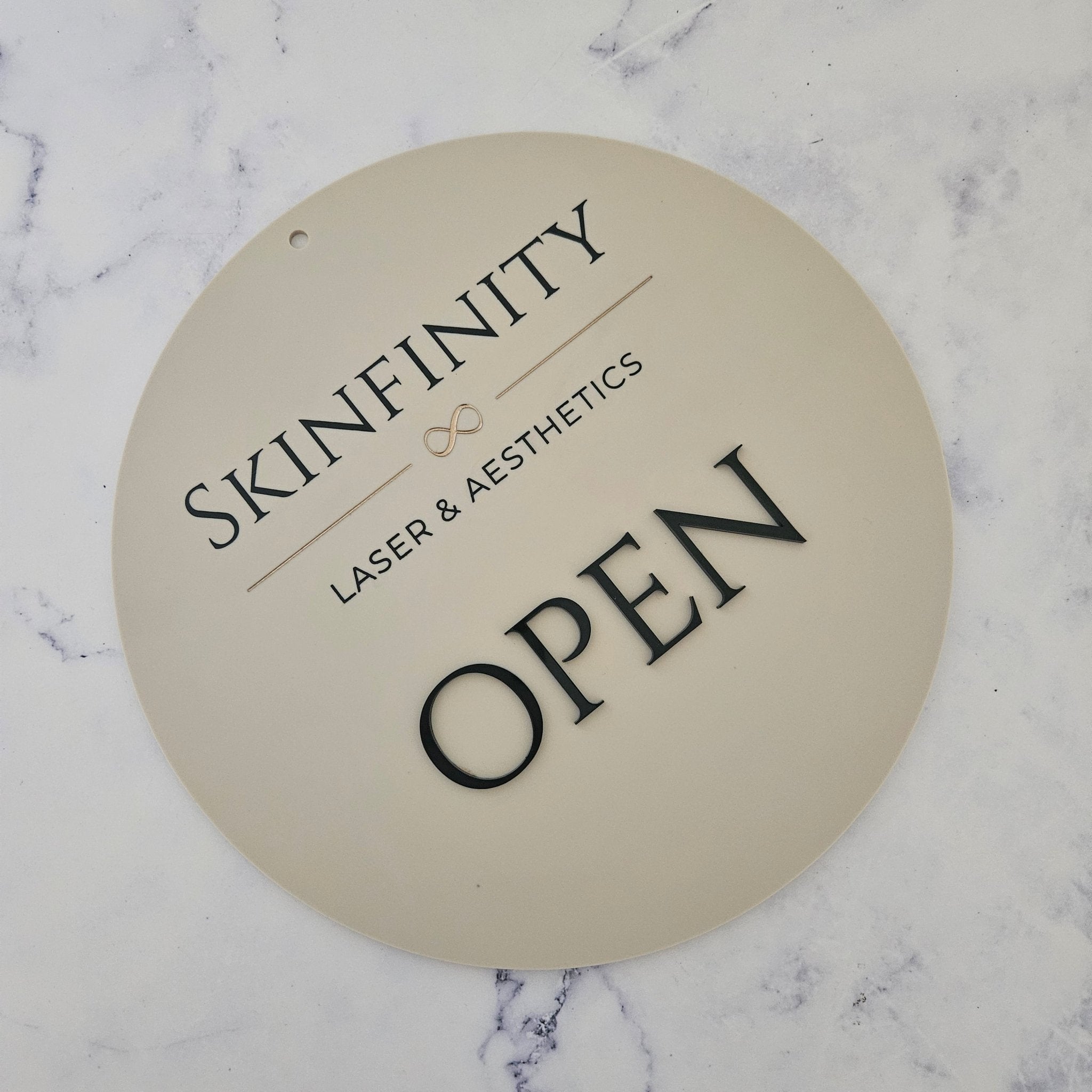 Open sign in round acrylic with black acrylic letters