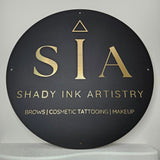 Round Business Sign in black with gold lettering