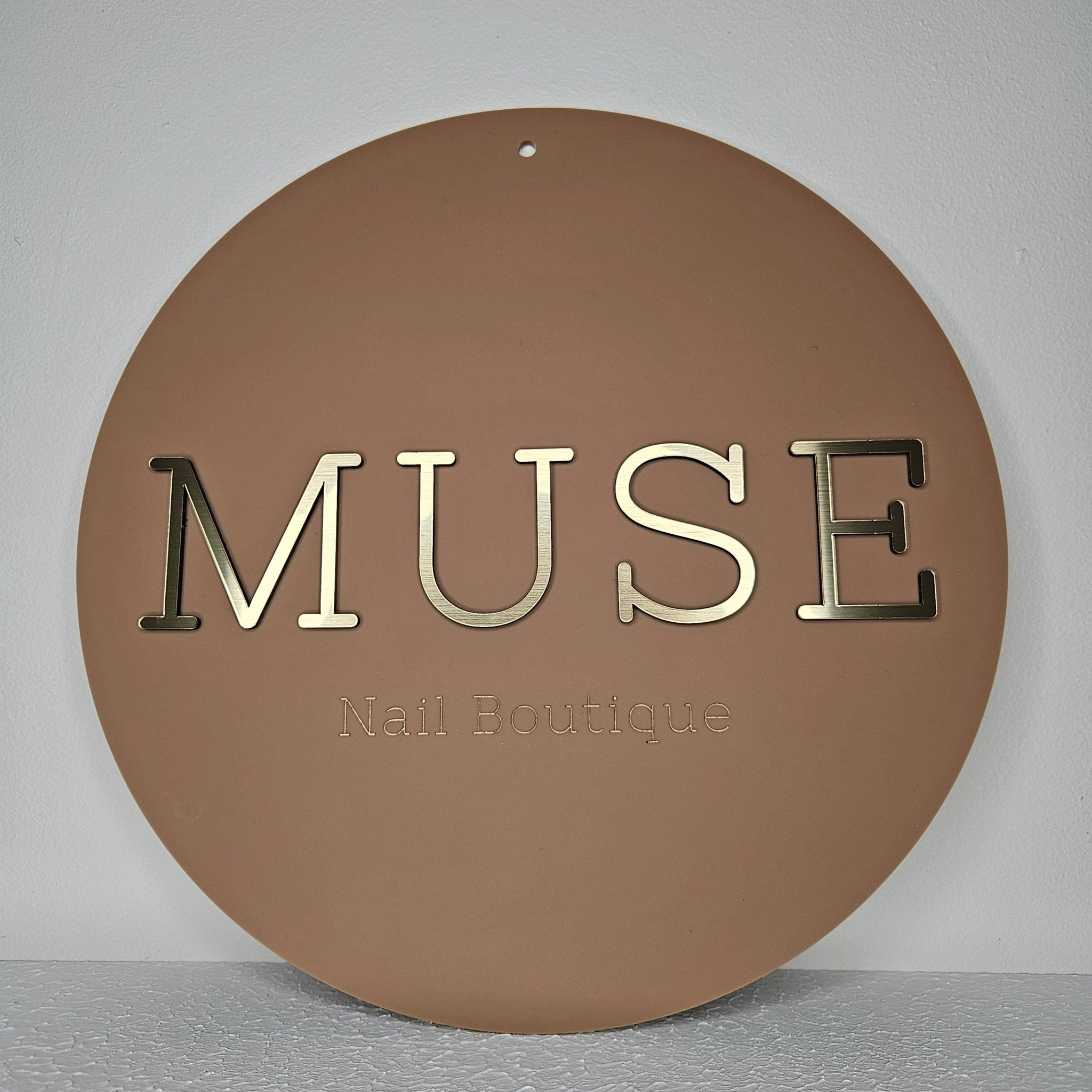 Round Business Sign with brushed gold acrylic lettering