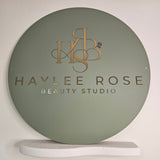 Round business sign in olive green acrylic and gold acrylic letters