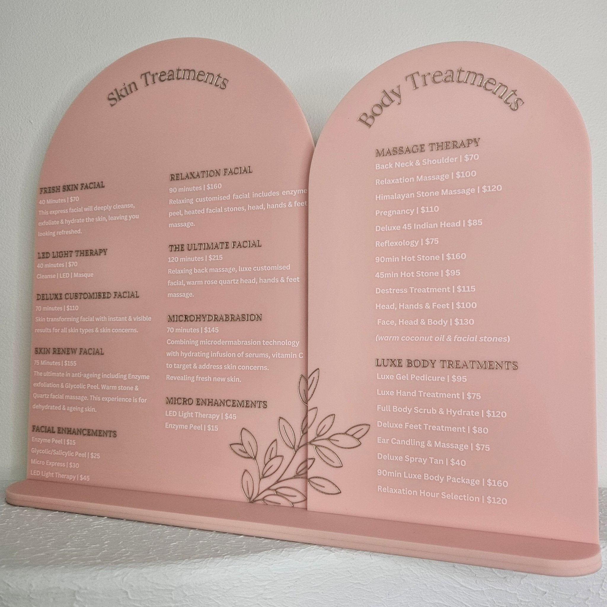 Double Arch treatment menu sign with gold engraving