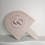 XL Arch Handheld Mirror in Almond Acrylic with Rose Gold Logo