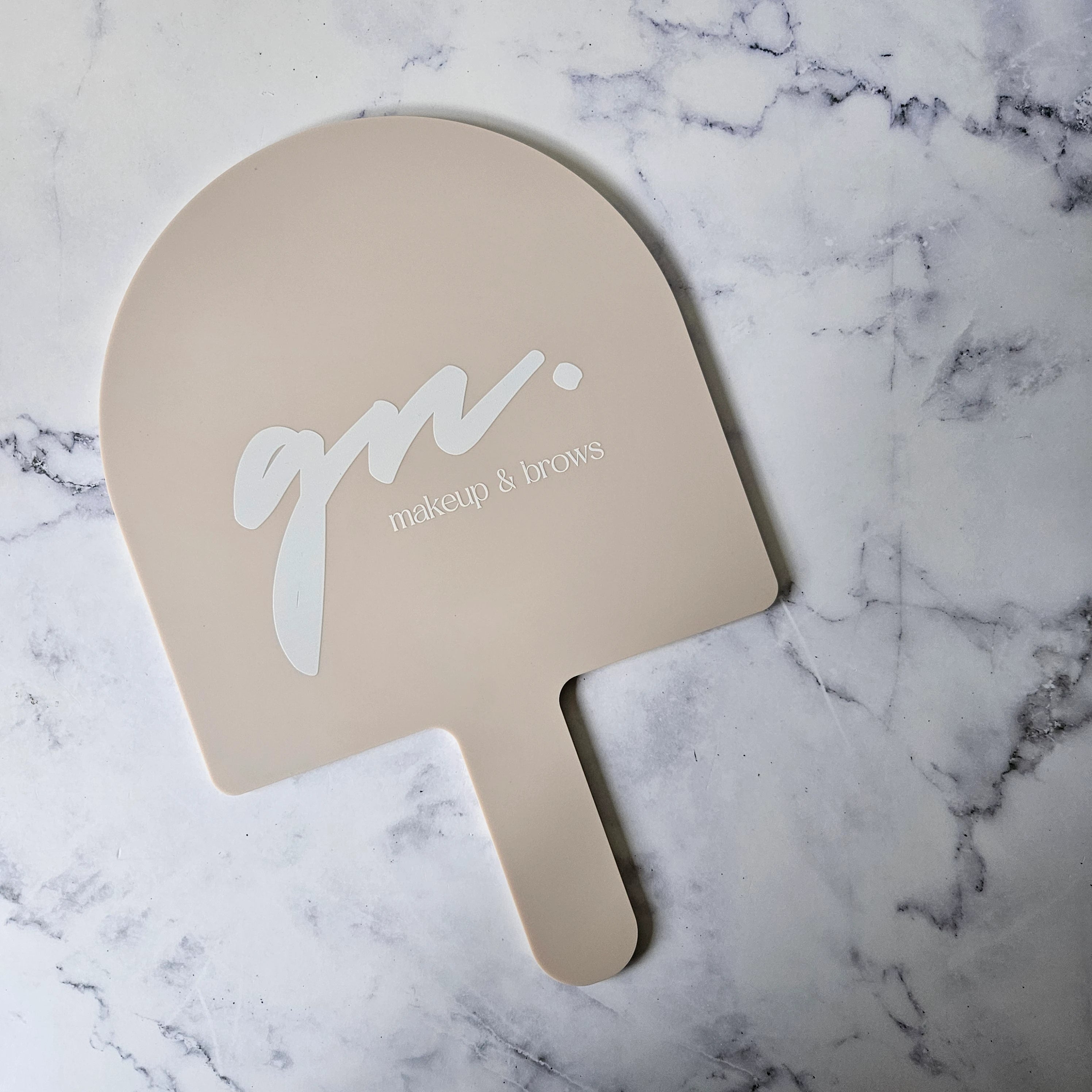 XL Arch Handheld Mirror in Latte Acrylic with White Logo