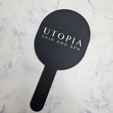 Oval handheld mirror in black acrylic with silver logo